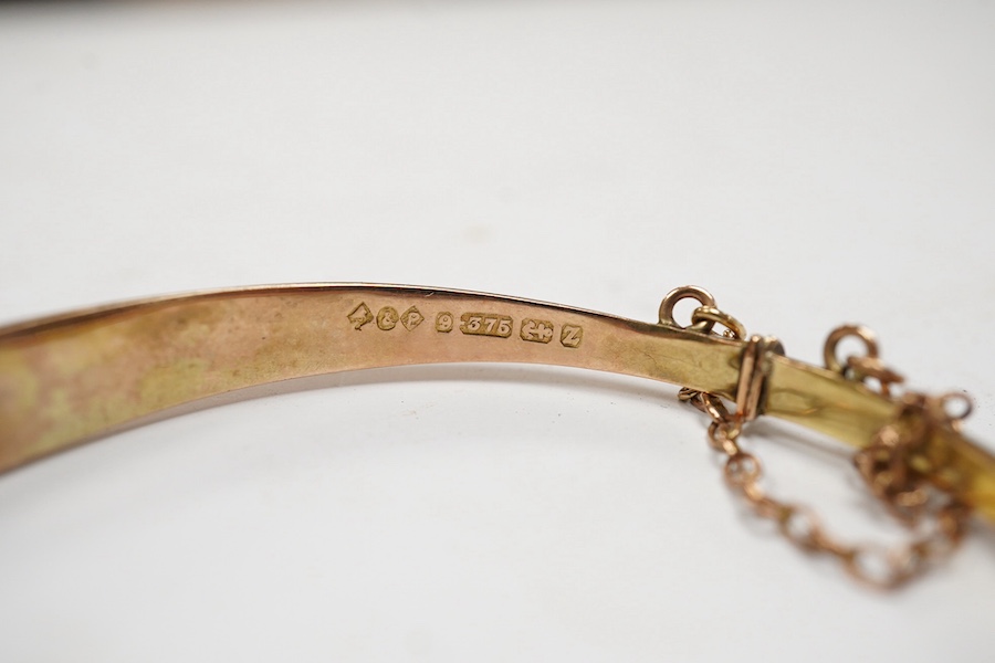 An Edwardian yellow metal, diamond and seed pearl set hinged bangle and one other late Victorian engraved 9ct gold hinged bangle, both a.f., gross weight 14.6 grams. Condition - poor